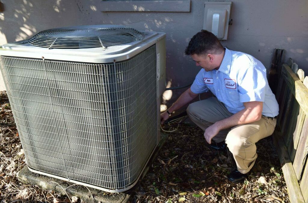 HVAC technician working on an air conditioning unit